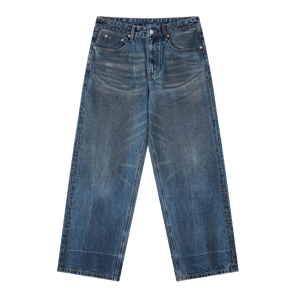 OMINA Essentials vintage wash baggy denim jeans with a relaxed fit and wide-leg silhouette in blue.