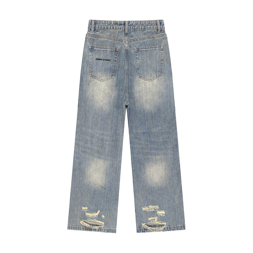 OMINA Vintage Wash Distressed Denim Jeans with a relaxed straight-leg fit and distressed detailing on the hem.