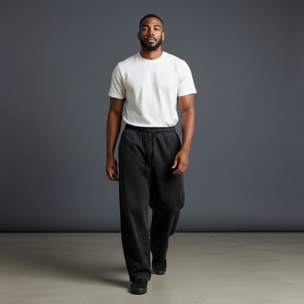 Omina Studio unisex vintage wash black cotton blend loose fit sweatpants with drawstring waist.