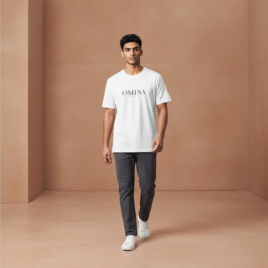 OMINA Studio white cotton t-shirt with minimalist front logo and bold back graphic. Model wears relaxed fit tee.