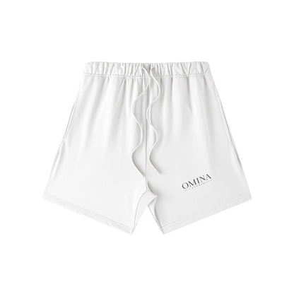 Omina Studio white heavyweight French terry shorts with drawstring and subtle logo detail. Relaxed fit for everyday comfort.