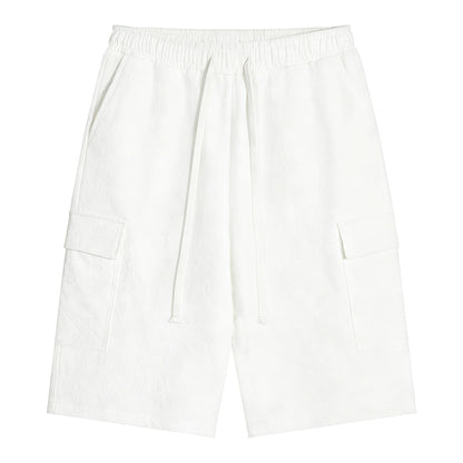 Omina white polyester cargo shorts with drawstring elastic waistband and functional pockets. Relaxed unisex fit.