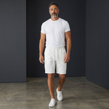 Omina white polyester drawstring cargo shorts with elastic waistband and functional pockets. Relaxed unisex fit.