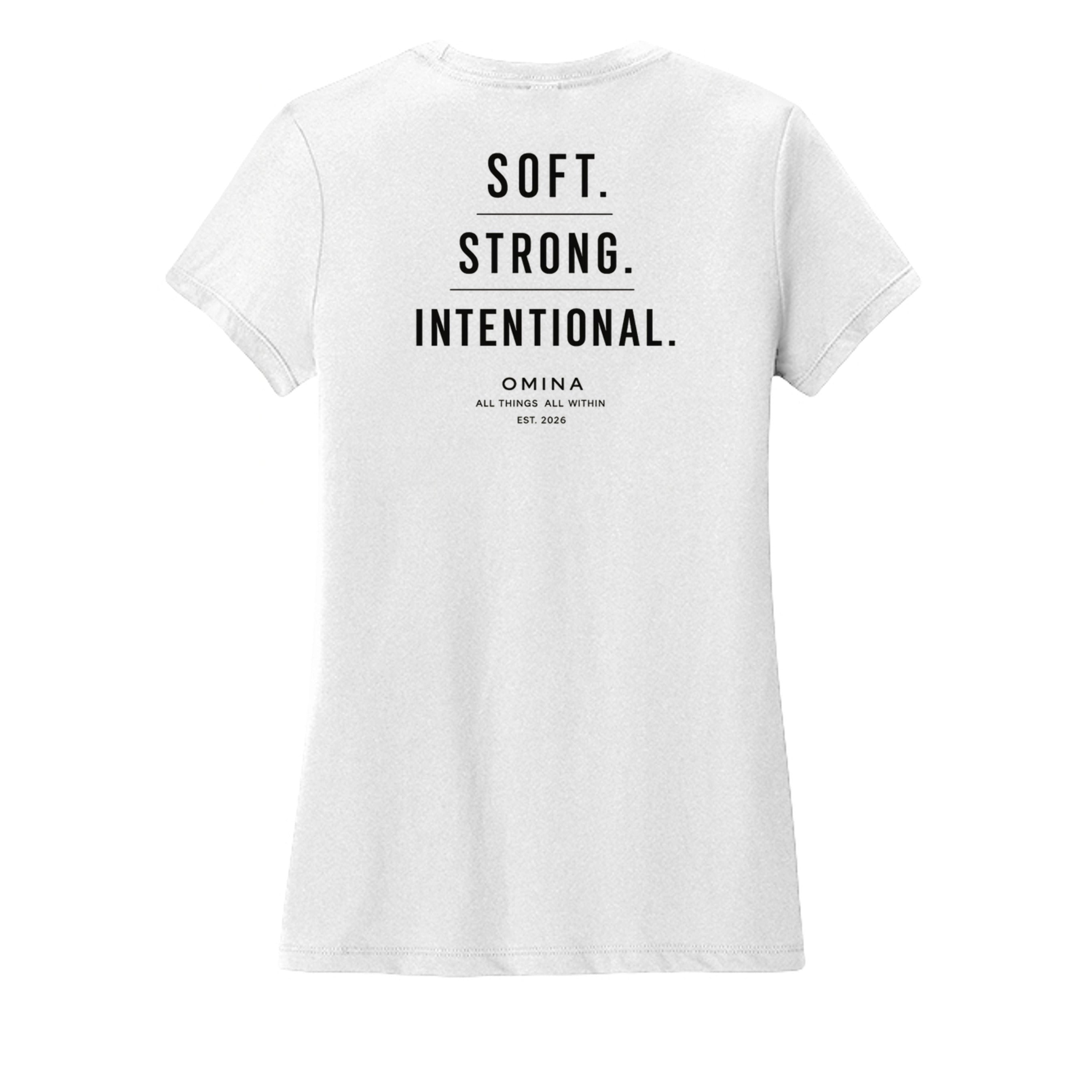 Omina white cotton t-shirt with black text reading SOFT. STRONG. INTENTIONAL. OMINA ALL THINGS ALL WITHIN EST. 2026.