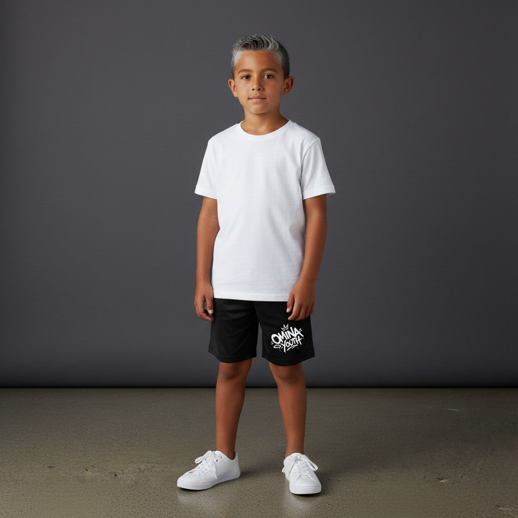 Omina Youth black relaxed fit shorts with white graffiti-style logo on the left leg. Elastic waistband.