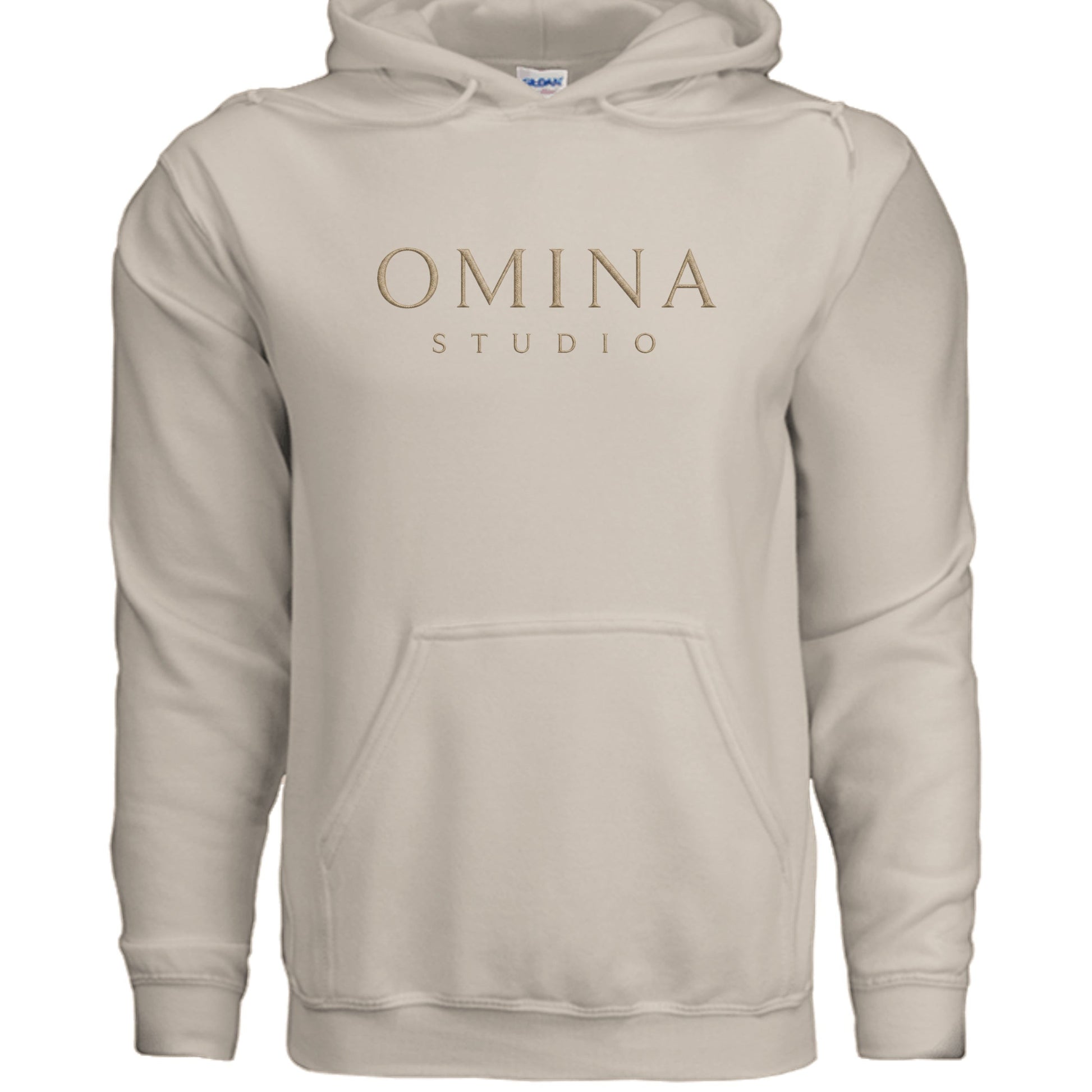 Omina Studio beige essential hoodie with kangaroo pocket and minimalist logo. Soft, durable fabric for comfort and versatile style.