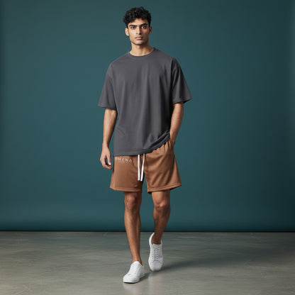 Omina Studio brown mesh drawstring shorts with relaxed fit and minimal branding.