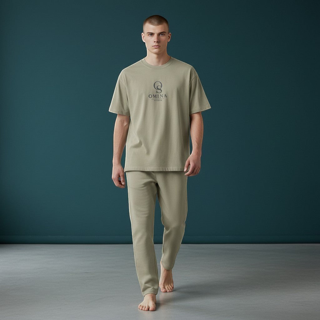 Omina Studio men's relaxed fit light olive cotton t-shirt and matching trousers set with subtle logo.